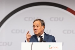 FILE - North Rhine-Westphalia's State Premier Armin Laschet, a candidate for chancellor of the conservative Christian Democratic Union (CDU) party, speaks at the regional CDU assembly in Duesseldorf, Germany, June 5, 2021.
