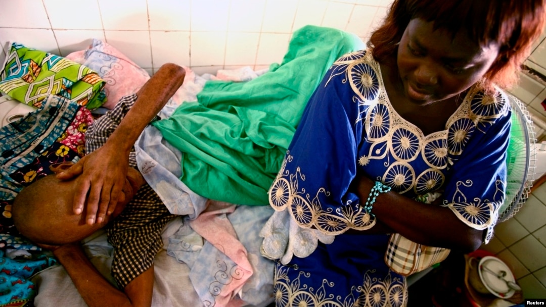 Jonas Lukano, 60, who is has diabetes, is watched over by his sister at the state general hospital in Congo's capital of Kinshasa. (file photo)