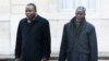 Imam Oumar Kobine Layama, right, and Bangui Archbishop Dieudonne Nzapalainga arrive for a meeting with French President Francois Hollande at the Elysee Palace, in Paris, Jan. 23, 2014 (AP Photo/Christophe Ena)