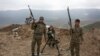 FILE - Armenian soldiers pose near a frontline in Nagorno-Karabakh, Azerbaijan, April 6, 2016. 