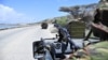 Soldiers patrol the seaport in Somalia's southern port city of Kismayo, November 29, 2012.