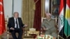 Iraqi Kurdish Regional President Massoud Barzani (R) meets with Turkish Foreign Minister Feridun Sinirlioglu (L) in Irbil, Iraq, Nov. 4, 2015.