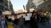 Activists in Syria’s besieged Aleppo protest against the United Nations for what they say is its failure to lift the siege off their rebel-held area, Sept. 13, 2016.