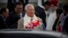 Malaysian Prime Minister Najib Razak holds a bouquet of flowers presented to him upon arrival in New Delhi, India, March 31, 2017.