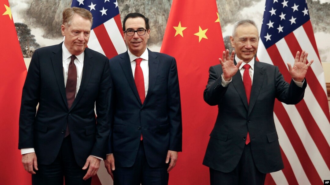 Chinese Vice Premier Liu He, right, gestures as U.S. Treasury Secretary Steven Mnuchin, center, chats with his Trade Representative Robert Lighthizer, left, before they proceed to their meeting at the Diaoyutai State Guesthouse in Beijing, May 1, 2019.