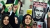 FILE - Turkish protesters shout anti-Russia slogans as they hold a poster of Russian President Vladimir Putin that reads in Turkish and Russian "Assassin Putin!" during a protest in Istanbul, Turkey, Nov. 27, 2015. 