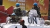 Soldiers with the UN peacekeeping force sit on top of an armored personnel carrier in the center of Goma, Eastern DRC, December 6, 2008. 