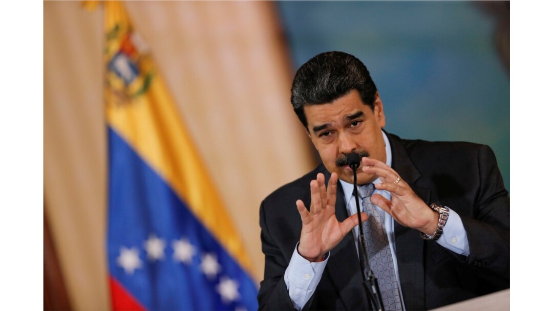 FILE - Venezuela's President Nicolas Maduro gestures as he speaks during a news conference in Caracas, Sept. 30, 2019.