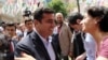 Greeted by supporters, Selahattin Demirtas, leader of pro-Kurdish Peoples' Democracy Party, smiles as he arrives at his party headquarters in Ankara, Turkey, June 9, 2015.