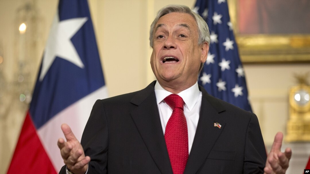 FILE - Sebastian Pinera speaks during an appearance with Secretary of State John Kerry at the State Department in Washington, June 3, 2013. 