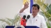 FILE - Philippine President Rodrigo Duterte gestures while answering questions during a news conference upon his arrival from a state visit in Japan at the Davao International Airport in Davao city, Philippines October 27, 2016. 