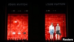 FILE - Louis Vuitton logo brad is seen outside a Louis Vuitton store in Paris, Jan. 27, 2020. 