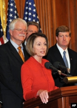 Nancy Pelosi joins fellow Democrats after the historic passage of the health care reform bill.
