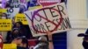 FILE - Activists opposing new voter legislation gather outside the House Chamber at the Texas Capitol in Austin, Texas, May 6, 2021.