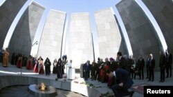 Pope Francis and Catholicos of All Armenians Karekin II attend a ceremony in commemoration of Armenians killed by Ottoman forces during World War I at the Tzitzernakaberd Genocide Memorial and Museum in Yerevan, Armenia, June 25, 2016. 