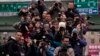 FILE - Journalists follow Tsai Ing-wen, then a presidential candidate, as she campaigns in Taipei, Jan. 13, 2016.