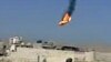This citizen journalism image purports to show a Syrian military helicopter on fire and falling to the ground after it was apparently hit during fighting between government forces and rebels in Damascus, Aug 27, 2012. AP IS UNABLE TO INDEPENDENTLY VERIFY 