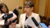 FILE - Kansas Gov. Laura Kelly speaks with reporters at the Statehouse in Topeka, Kansas, June 5, 2019.