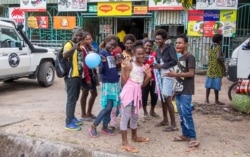 People are seen on a street ahead of a historical independence vote, in the capital Buka on Nov. 22, 2019.