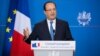 French President Francois Hollande addresses the media at the end of a two-day EU summit in Brussels, Dec. 20 2013