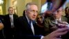 Senate Majority Leader Sen. Harry Reid is surrounded by reporters after leaving the office of Senate Minority Leader Sen. Mitch McConnell on Capitol Hill, Oct. 14, 2013.
