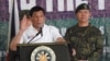 FILE - Philippines' President Rodrigo Duterte gestures as he talks to the troopers during his visit to Camp Teodulfo Bautista in Jolo, Sulu, Philippines.