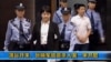 Video image from CCTV shows Gu Kailai, second from left, being taken into the Intermediate People's Court, Hefei, China, Aug. 9, 2012.