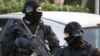 Policemen (GIPN) take part in a search in Coueron, western France as part of dawn raids in several French cities, March 30, 2012.