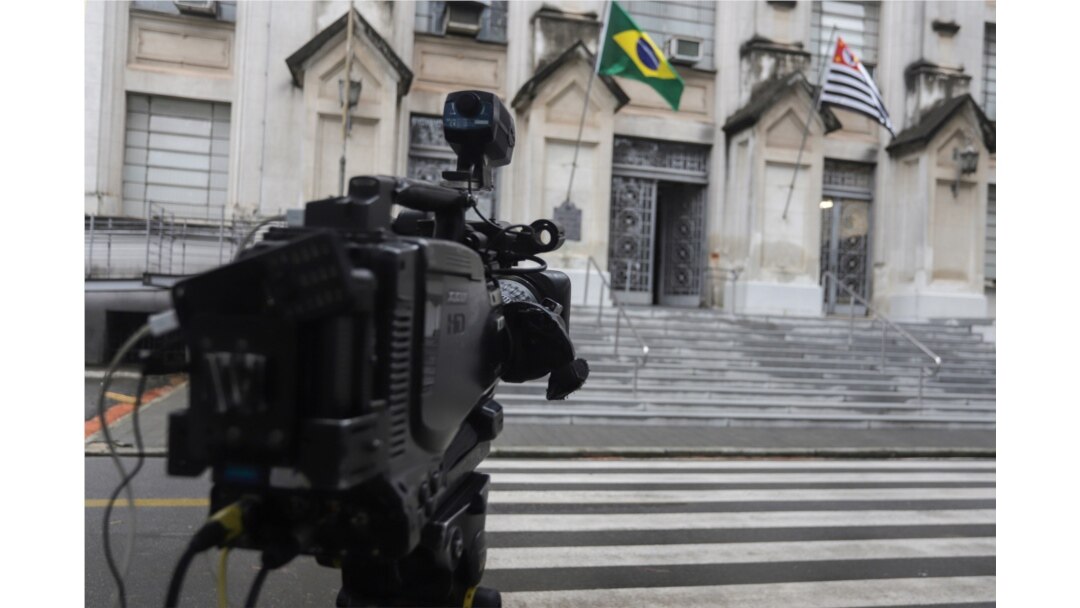 A TV camera sits in front of Adolfo Lutz Institute, which is responsible for double checking the coronavirus test results, in Sao Paulo, Brazil, Feb. 26, 2020.