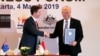 Indonesia's Trade Minister Enggartiasto Lukita and Australia's Minister of Trade, Tourism and Investment Simon Birmingham shake hands after signing an economic partnership agreement aimed at boosting trade and investment, March 4, 2019, in Jakarta.