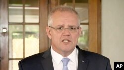 FILE - In this image made from video, Australia's Prime Minister Scott Morrison talks to media on May 17, 2019, in Cairns, Australia. 