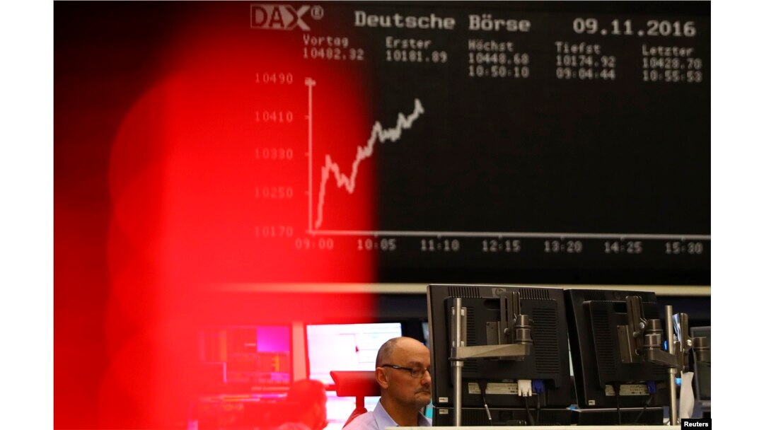 A trader at the Frankfurt stock exchange reacts in Frankfurt, Germany, Nov. 9, 2016.