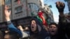 FILE - Palestinians chant in protest during a demonstration against the chronic power cuts in Jabaliya refugee camp, northern Gaza Strip, Jan. 12, 2017.
