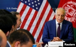FILE - U.S. special envoy for peace in Afghanistan, Zalmay Khalilzad, talks with local reporters at the U.S. embassy in Kabul, Afghanistan, Nov. 18, 2018.
