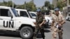 Members of the United Nations observers mission in Syria, who have left their bases in the province of Homs in Central Syria, return to their hotel in Damascus on August 20, 2012.