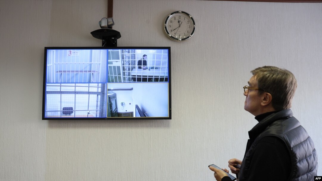 French researcher Laurent Vinatier appears on a screen via a video link during a hearing of an appeal against his prison sentence he was handed in October, at the Moscow City Court, Feb. 24, 2025. 