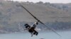 FILE - A Turkish Cobra military helicopter flies during an exercise in Izmir, May 26, 2010.