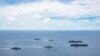 美国海军的尼米兹号和里根号航空母舰组成的双航母战斗群7月6日在南中国海航行。（美国海军提供）
