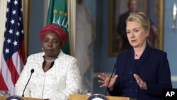 Secretary of State Hillary Rodham Clinton speaks to the media as African Union Chairperson Nkosazana Dlamini-Zuma, listens after their meeting in Washington, November 28, 2012.