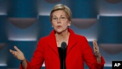 Sen. Elizabeth Warren, D-Mass., speaks, the crowd continues to cheer