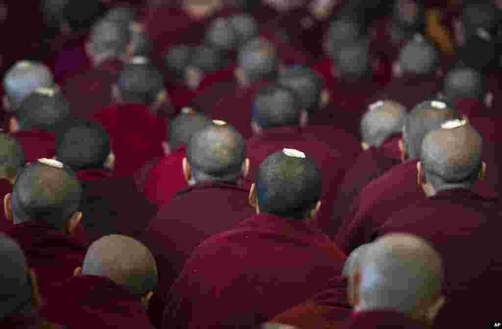 Exile Tibetan Buddhist monks listens as their spiritual leader the Dalai Lama speaks at the Tsuglakhang temple in Dharmsala, India, March 14, 2017.