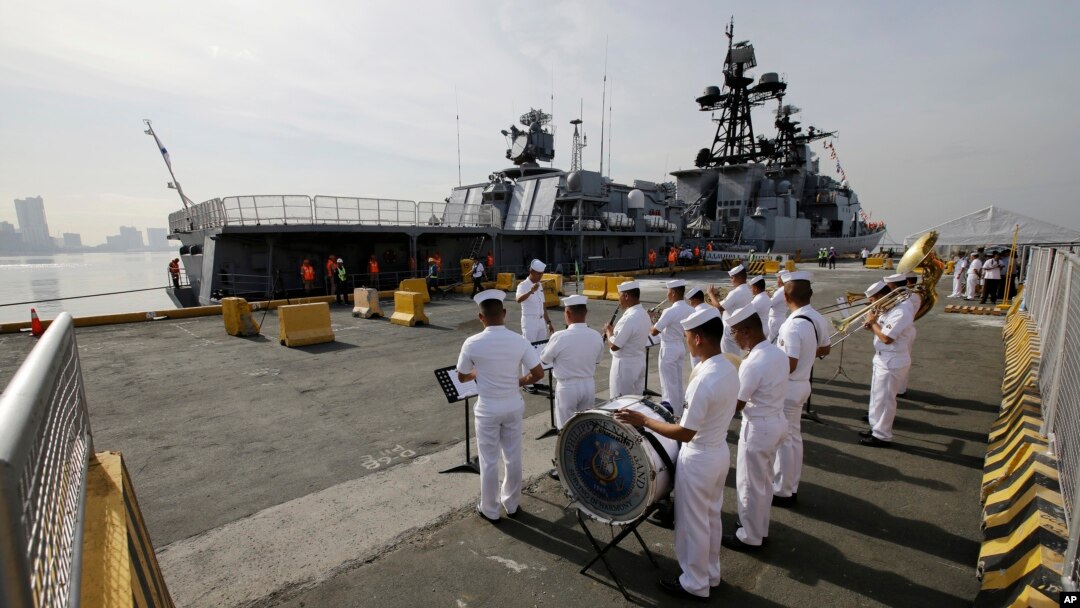 A Philippine Navy Band plays as the Russian Navy vessel Admiral Tributs, a large anti-submarine ship, docks at Manila's pier, Philippines, Jan. 3, 2017. Two Russian Navy Vessels are in the country for a goodwill visit until Jan. 7.