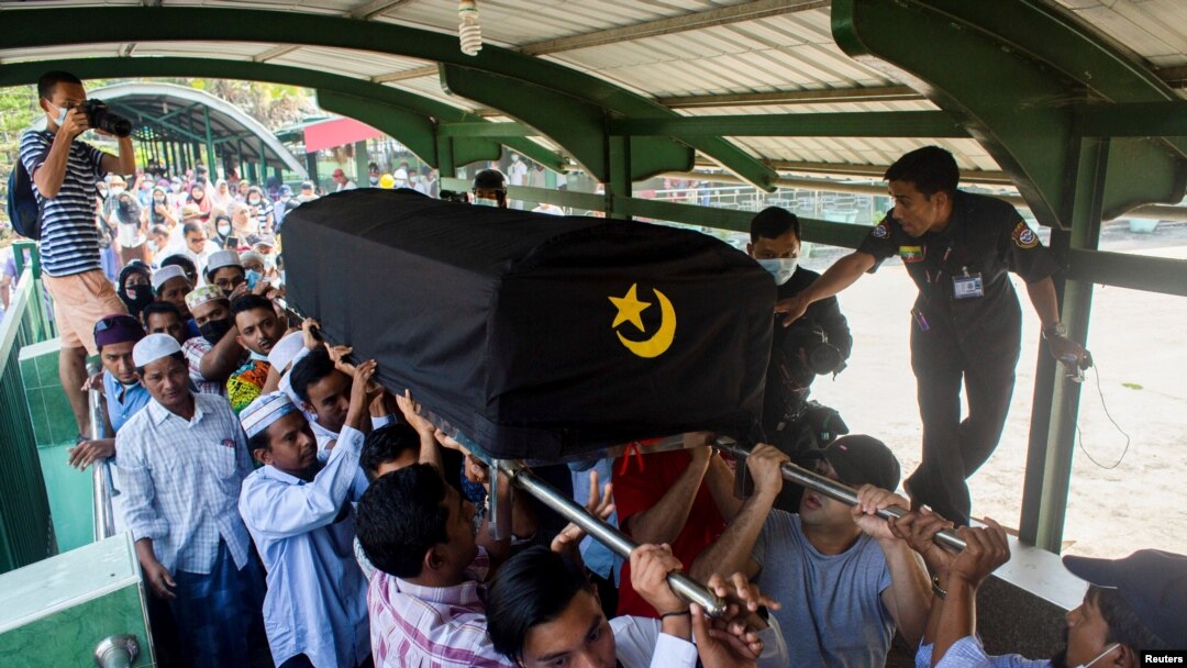 People attend a funeral of U Khin Maung Latt, 58, National League for Democracy (NLD party member in Yangon, Myanmar, March 7, 2021.