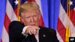 FILE - President-elect Donald Trump, taking questions at his news conference in New York on Jan. 11, 2017, says reports that Russian agents collected damaging information about him were "all fake news. It's phony stuff. It didn't happen."