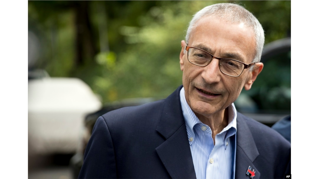 FILE - Hillary Clinton campaign chairman John Podesta speaks to members of the media outside Clinton's home in Washington, Oct. 5, 2016. The WikiLeaks organization on Oct. 7, posted what it said were thousands of emails from Podesta.