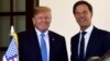 President Donald Trump, left, welcomes Dutch Prime Minister Mark Rutte, right, to the West Wing of the White House in Washington, July 2, 2018. 