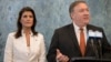 FILE - Former U.S. Secretary of State Mike Pompeo, right, with former U.S. Ambassador to the United Nations Nikki Haley, left, speaks at UN headquarters, July 20, 2018. Donald Trump said the two, who served in his first administration, will not serve in his second administration.