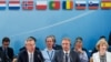 NATO Secretary General Jens Stoltenberg, left, talks during a North Atlantic Council Meeting at NATO headquarters in Brussels, July 28, 2015.