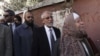 Muslim Brotherhood leader Mohammed Badie, second right, waits in line outside a polling place in Beni Suef, Egypt, to vote on a constitution drafted by Islamist supporters of President Mohammed Morsi, Saturday, Dec. 22, 2012.