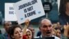 FILE - Demonstrators shout slogans during a protest against the arrest of three prominent activists for press freedom, in central Istanbul, Turkey, June 21, 2016. Arrest warrants for 42 Turkish journalists were issued Monday in connection with the failed coup July 15, 2016.